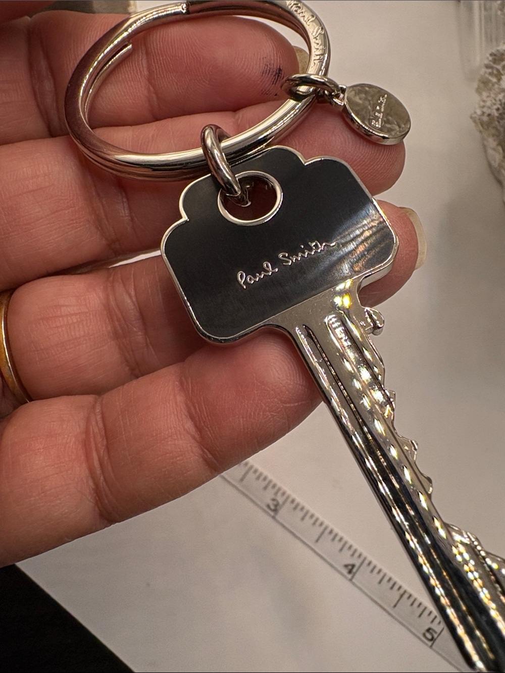 Paul Smith Polished Silver Key-Shaped Keyring with Signature Tag